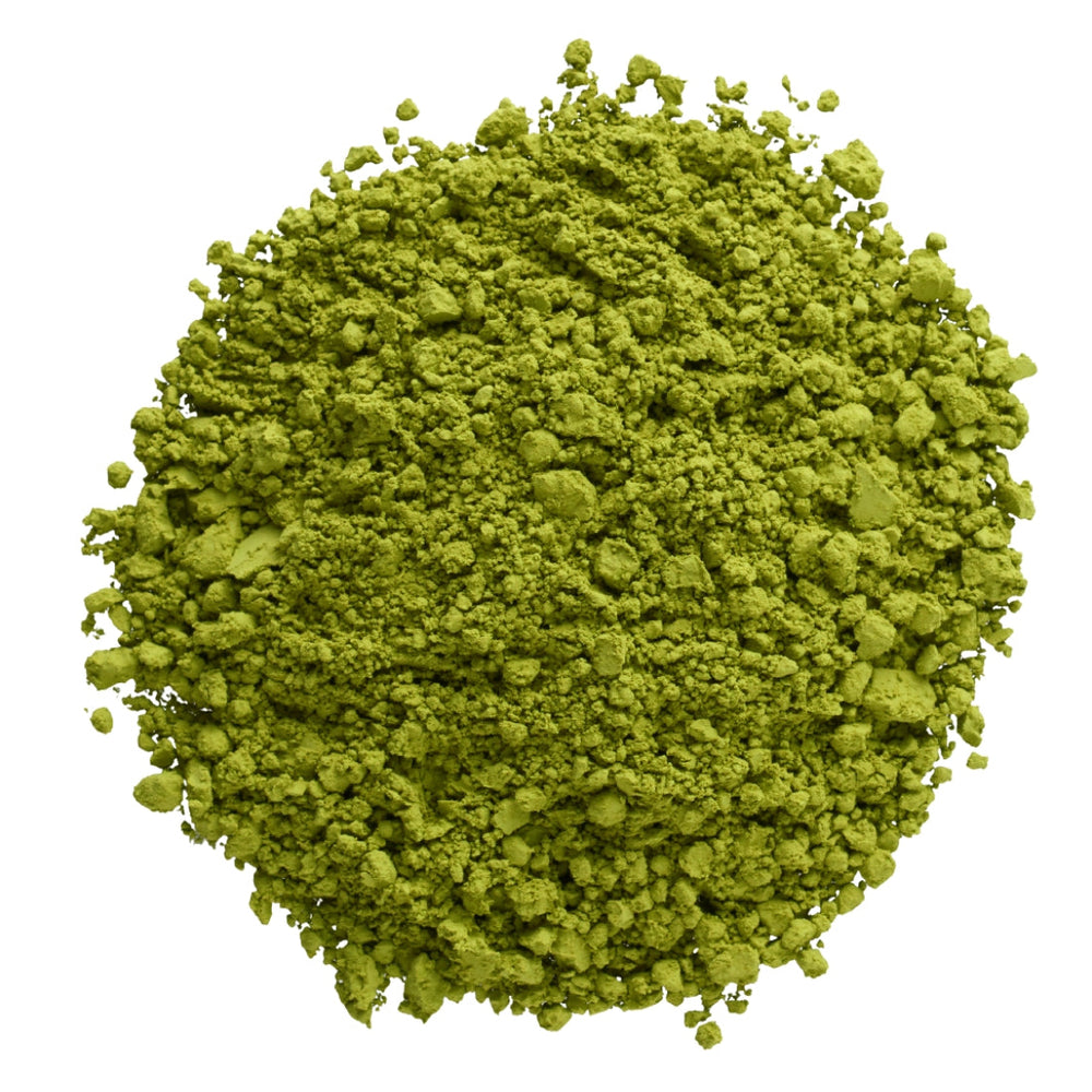 Green powder on a white background